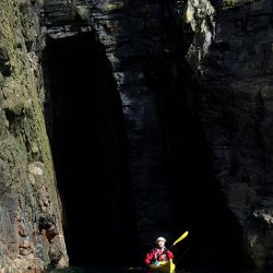sea kayak exploring caves
