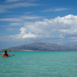 sea kayak and tropical-looking sea in Scotland