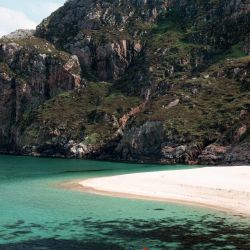 kayaking in the shadow of cliffs