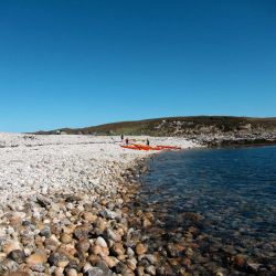 sea kayaks on a beach east coast of Uist